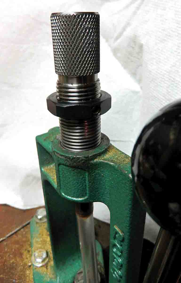 With the blowtube still in the die, screw the die into the press.